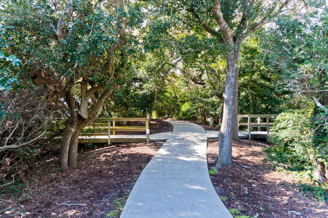 Shaded walkway beneath trees at Coral Shores 12