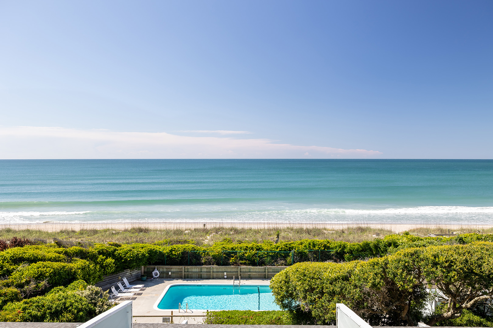 Oceanfront pool and Atlantic shoreline at Coral Shores 12