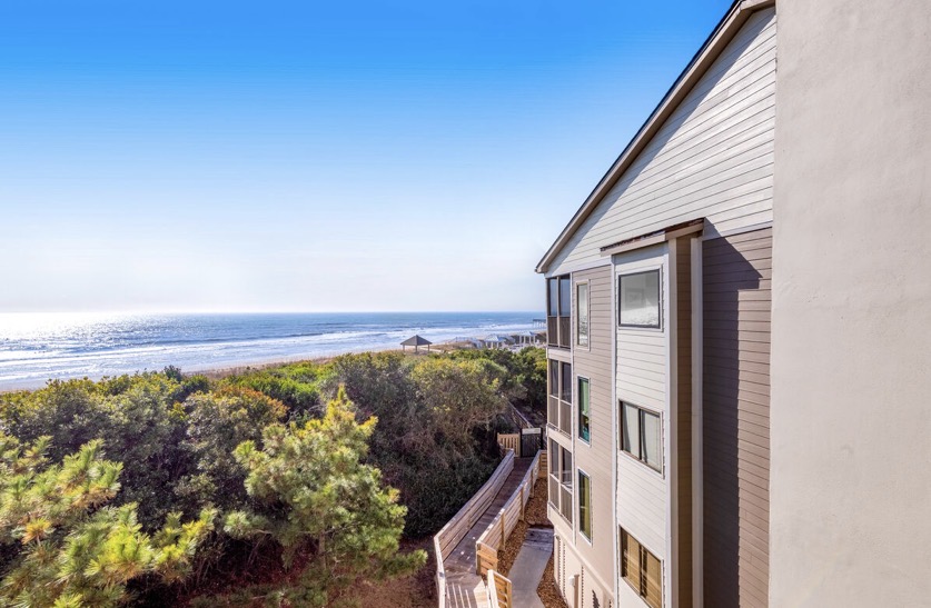 Ocean and dune view from the deck at Island Beach & Racquet Club B302