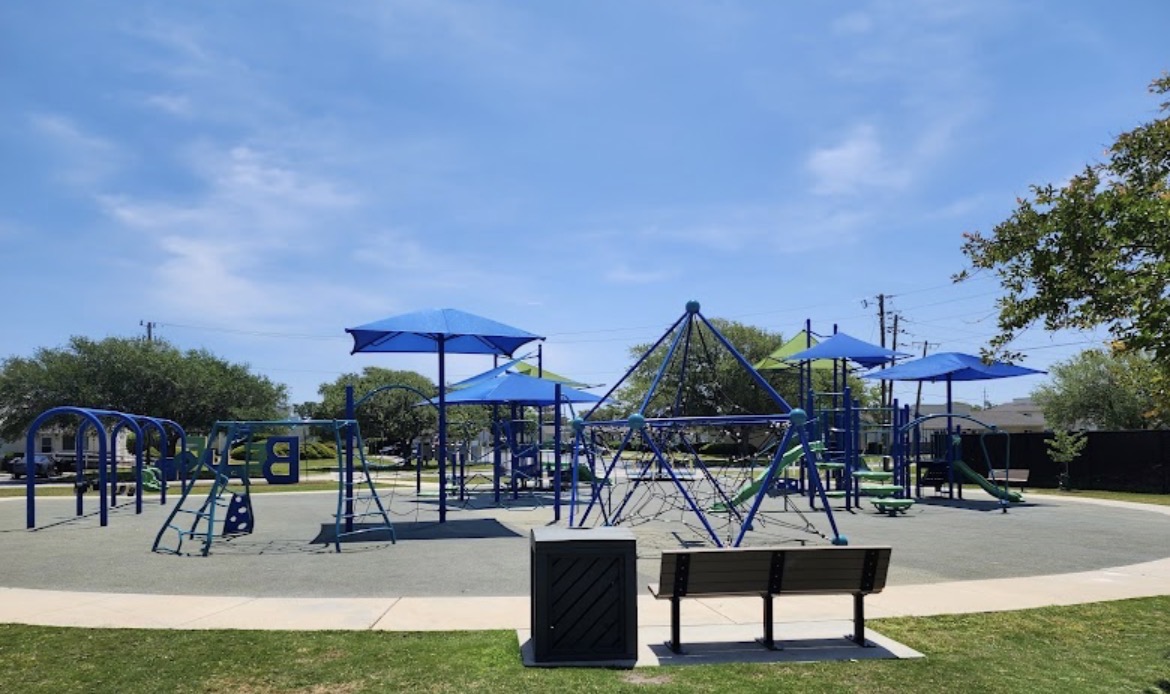 Randolph Johnson Park in Beaufort with blue play structures, climbing net and shade canopies