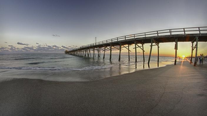 Sunrise light beneath Oceanana Fishing Pier in Atlantic Beach, NC