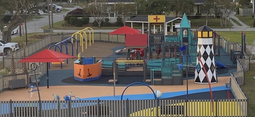 Shevans Park playground in Morehead City with a lighthouse climbing tower, pirate ship and splash pad