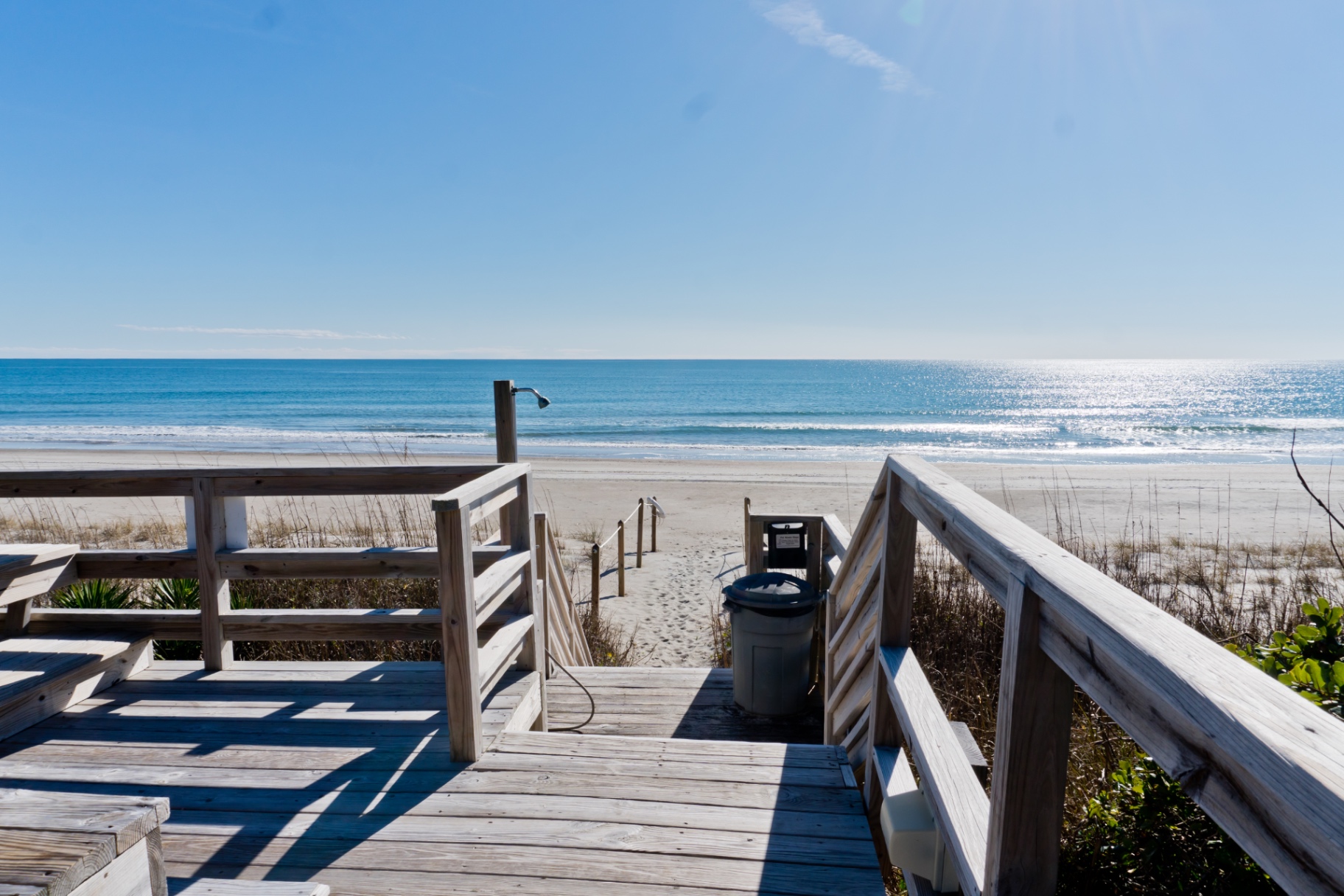 Beach access deck with an outdoor shower at Coral Shores 12