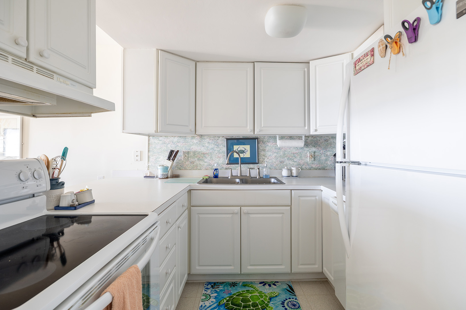 White kitchen and sink area at Coral Shores 12