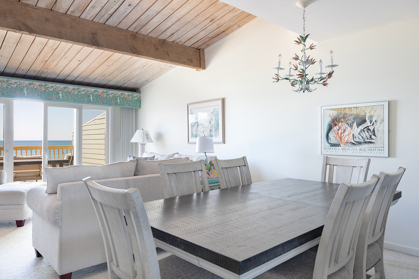 Dining table for eight beside the living room at Coral Shores 12